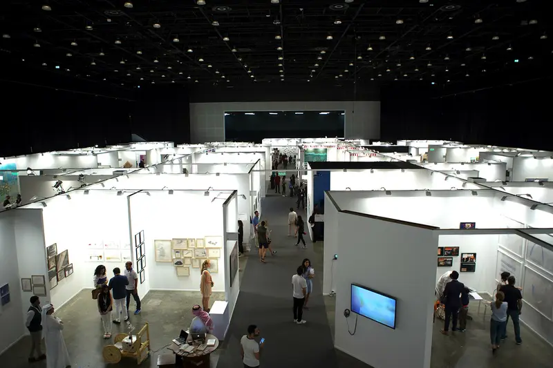 Gallery booths in a hall at Art Dubai 2016