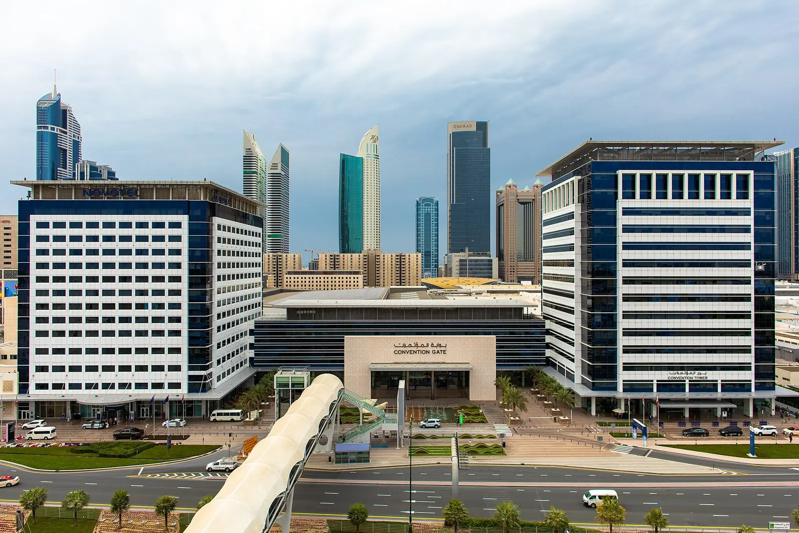 The Dubai World Trade Centre convention gate with towers of Sheikh Zayed Road behind